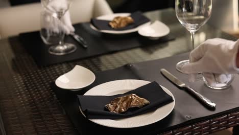 formal restaurant table setting with gold plated dish