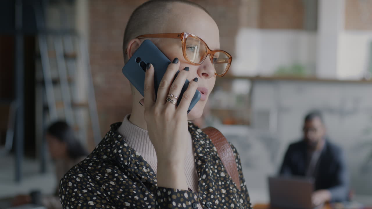 Woman on Phone Call in Modern Office