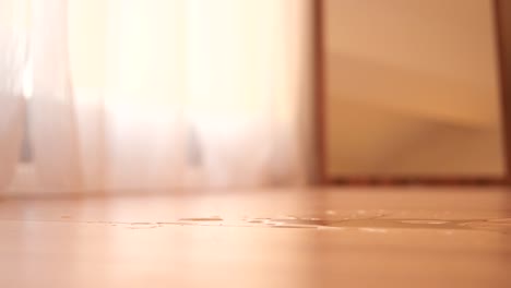 spilled water and broken bottle on floor