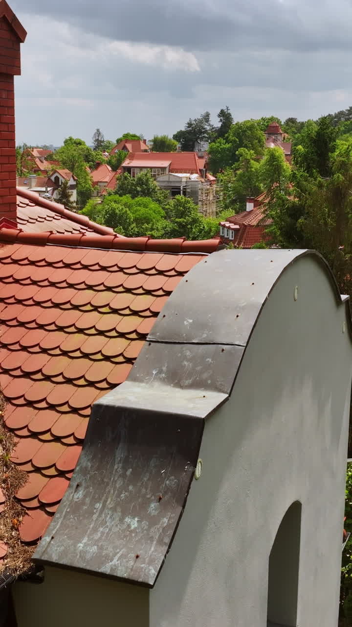 Vertical drone shot in middle of unique homes in the suburbs of Sopot, Poland