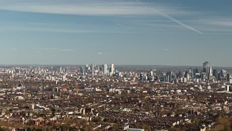 wide panoramic aerial view across london city landscape and vast surrounding district suburbs