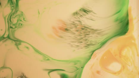 orange and green psychedelic colors painting in motion - abstract background