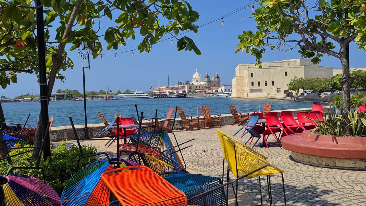 Cartagena Colombia. Deserted Seaside Cafe Bar on Hot Sunny Day With View of Old Town