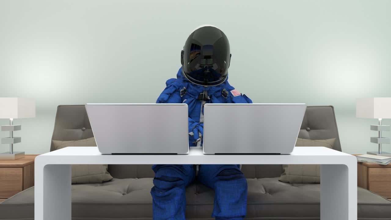 우주복을 입은 우주비행사가 노트북 컴퓨터와 함께 코드를 작성합니다.