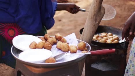 African-native-woman-making-traditional-food-in-the-countryside,-Full-HD