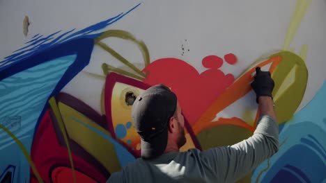 Graffiti-artist-painting-with-aerosol-spray-4k