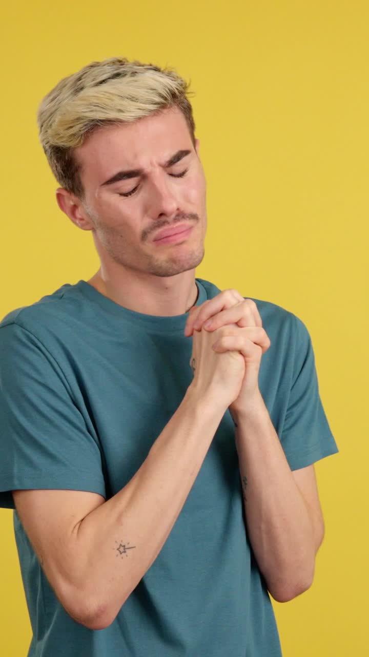Man Praying with Hands Together