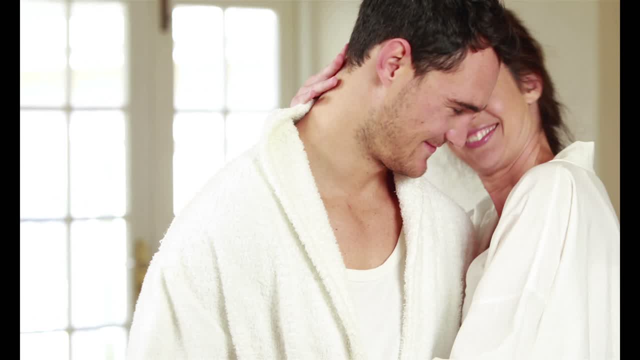 Attractive couple hugging with affection