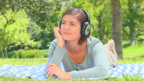 young woman listening to music with headphones