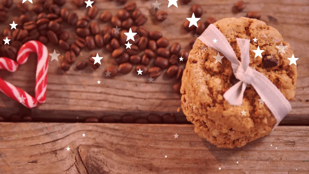 animación de estrellas caída sobre galletas y granos de café