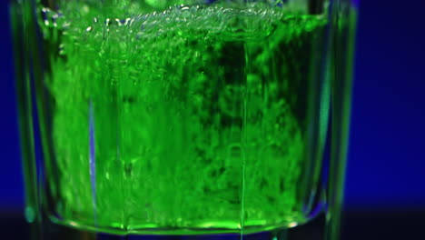 green liquid in a glass