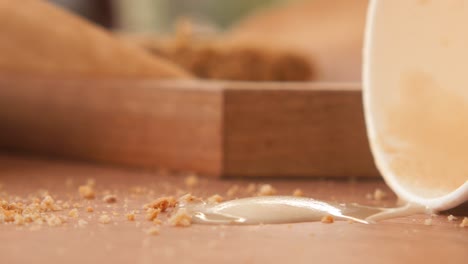 spilled ice cream on a wooden table