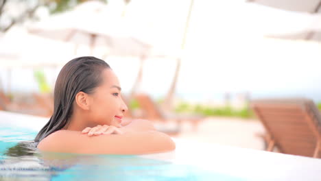 Profile-of-Sexy-Exotic-Woman-Enjoying-in-Swimming-Pool-Water-on-Tropical-Holiday-Slow-Motion-Full-Frame