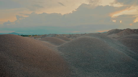 gravel hills at sunset