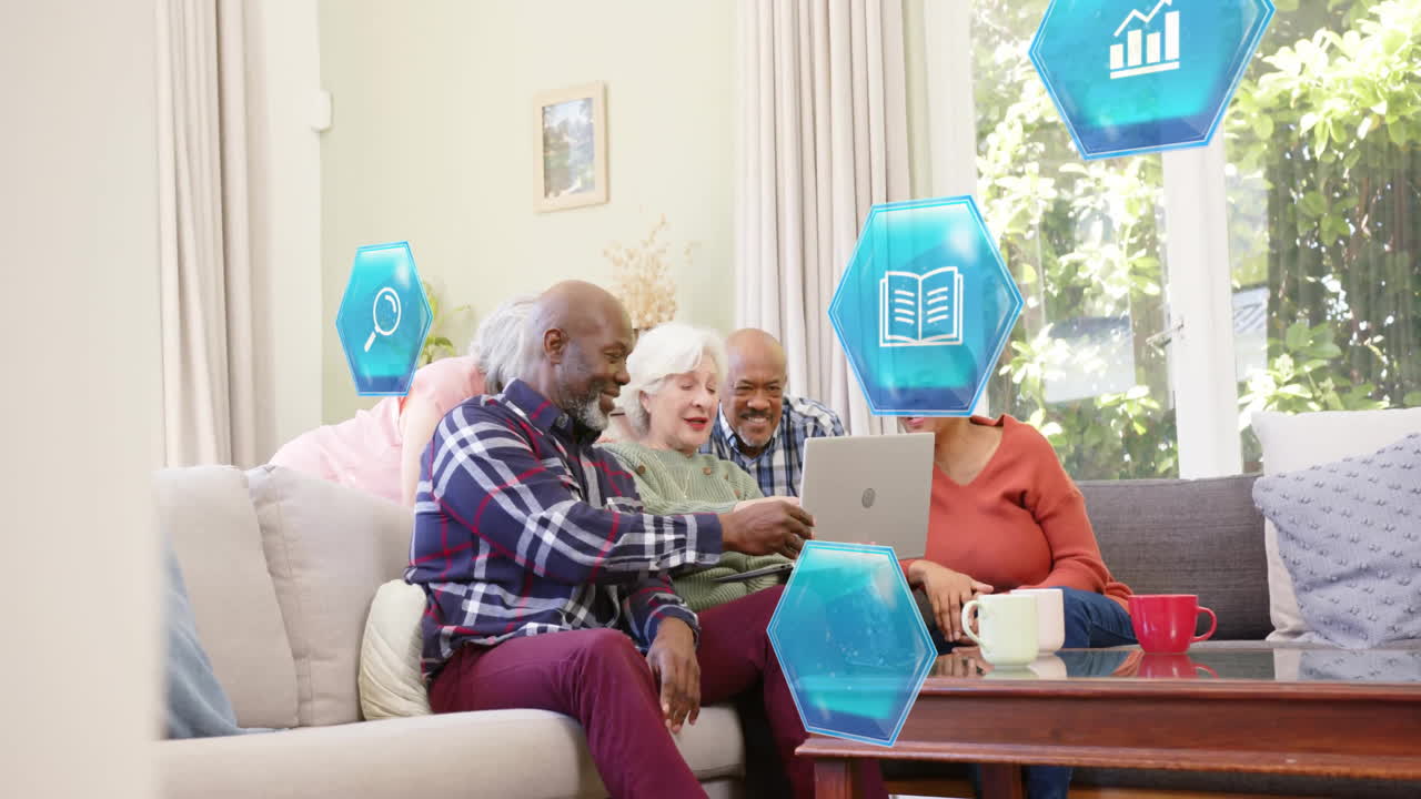 Animation of social media icons and data over smiling senior diverse friends with laptop