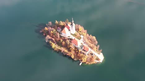 bird's eye view of lake bled island in slovenia during the autumn season