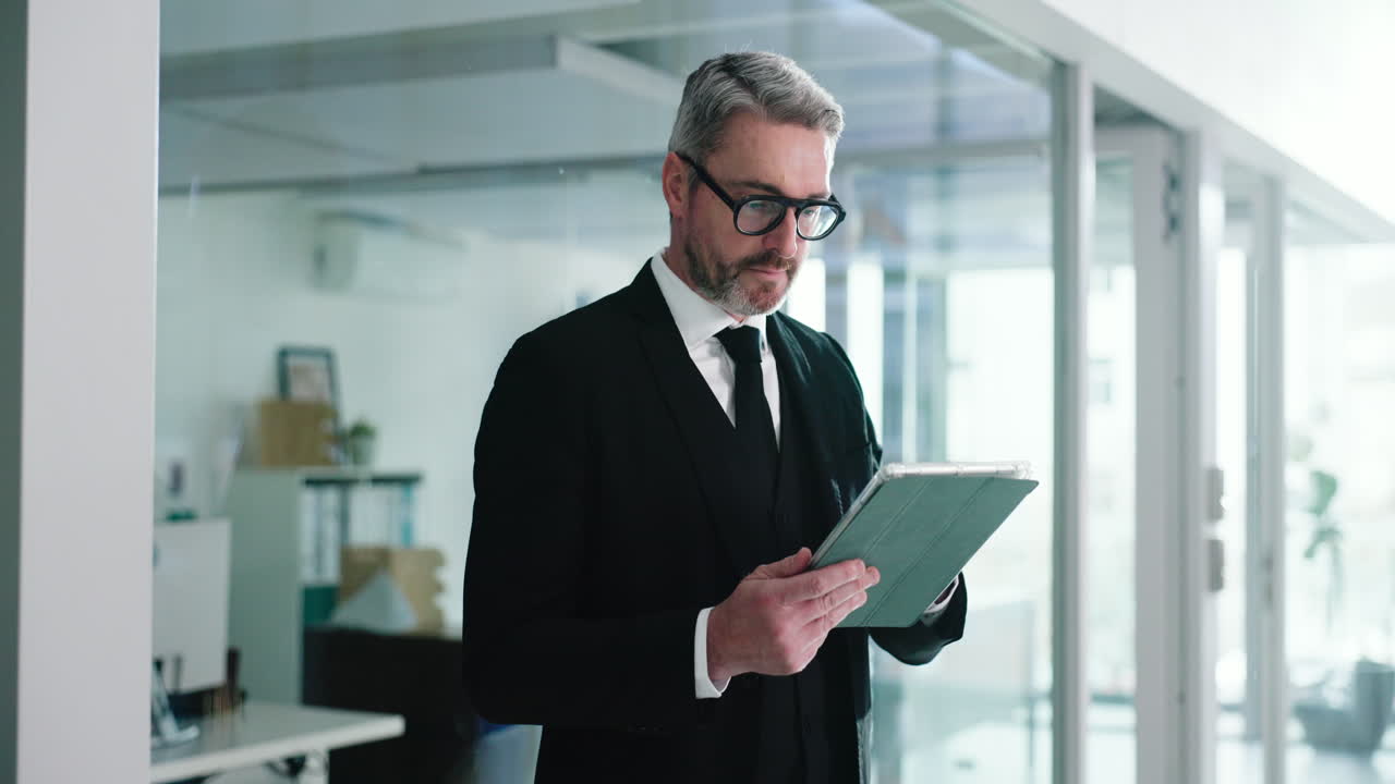 Professional businessman using a tablet in a modern office