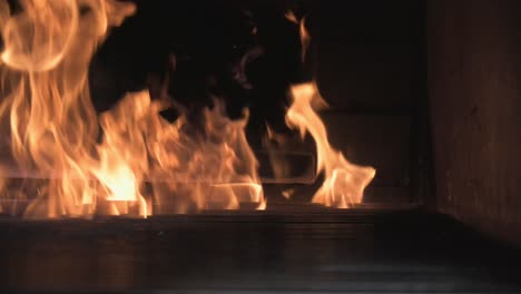 a fire burning in a stone furnace filmed