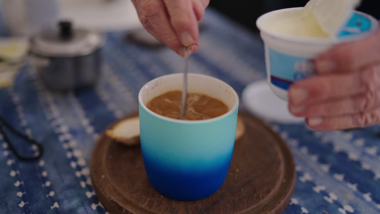 A creamy coffee served in a blue cup, reflecting the warmth of Argentine culture.