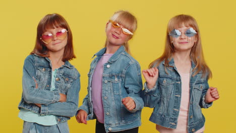 three girls friends wearing sunglasses listening music dancing disco fooling around having fun