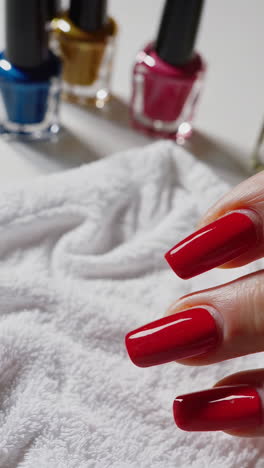 nail polish and white towel