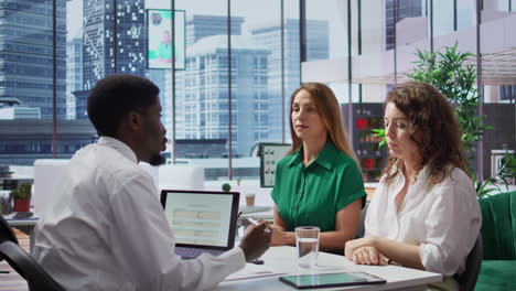 hr manager discussing with the last two remaining job candidates