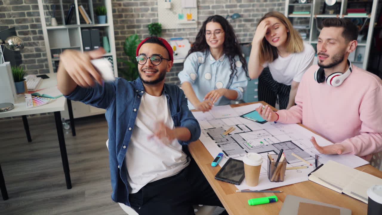 Team Meeting and Selfie in a Modern Office