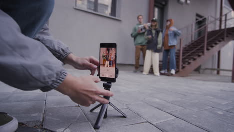 friends practising dances on the street