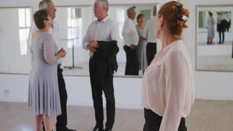 Caucasian-senior-woman-spending-time-in-a-ballroom