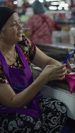woman in apron at market