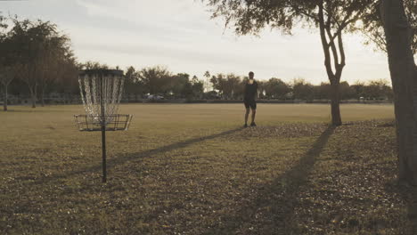 Disc-Golfer-Misses-25-Foot-Putt-off-the-Top-of-the-Basket-and-Disc-Flys-off-the-Top-Band