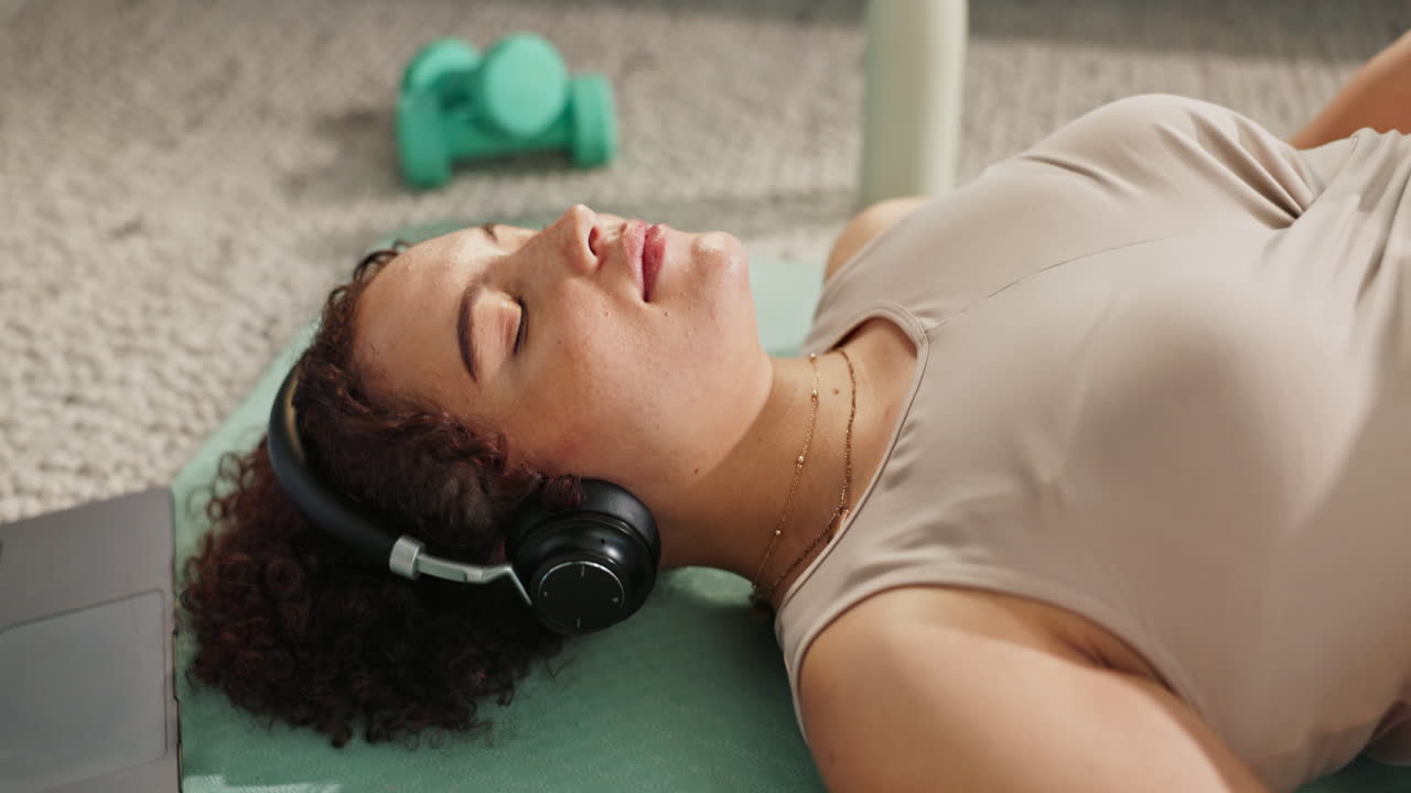 Woman relaxing after a home workout