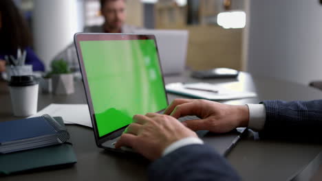 Close-up-view-of-businessman-hands-using-computer