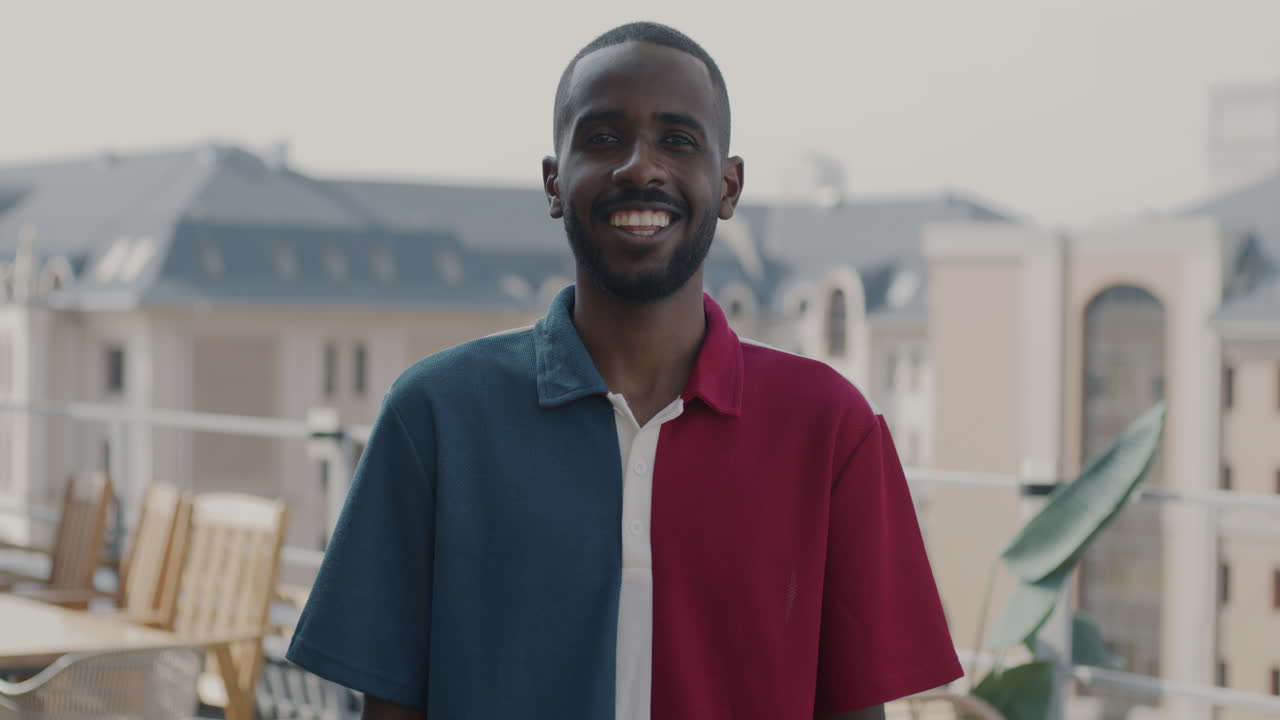 Smiling Man on Rooftop