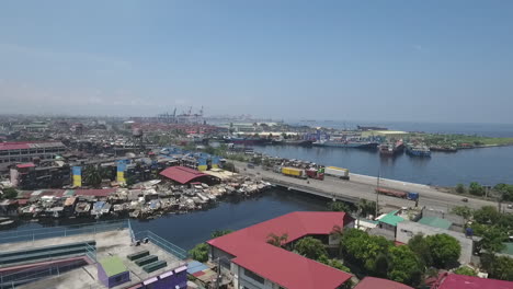 Aerial-of-Slum-Area-along-the-polluted-canal-in-Tondo-Manila,-Philippines