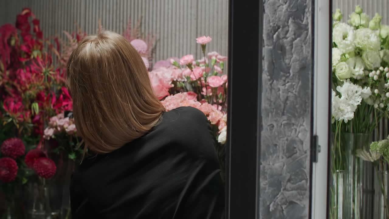 Woman working in a flower shop