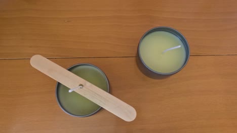 Scented-soy-candles-making,-candle-wax-hardening-in-a-metal-jar,-wax-curing-timelapse