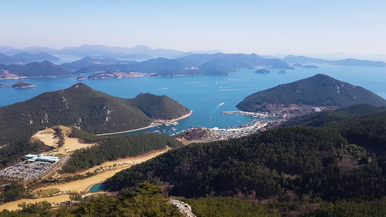 Stunning wide angle landscape of Korean coastal region with islands mountains and blue sea water