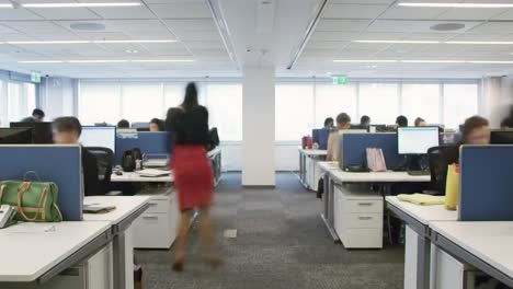 a dynamic office environment showcasing employees in action, collaborating, and engaging with modern workspaces in a vibrant corporate setting