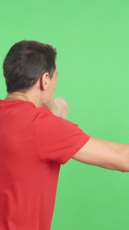 rear view of a man waving a costa rican pennant
