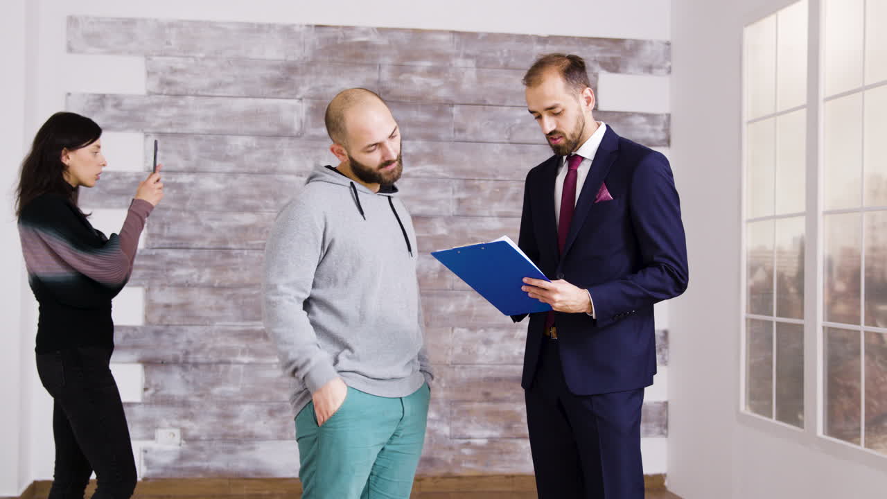 Real Estate Agent Discussing Contract with Client