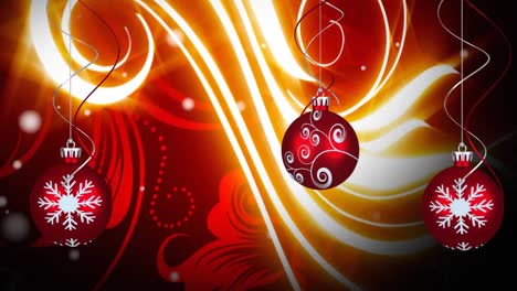 animation of three christmas red baubles decoration with snow falling and glowing pattern