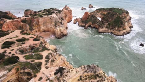 flying over unique rock formations and sandy beaches of ponta de piedade