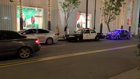 cars lit up with colorful christmas decorations