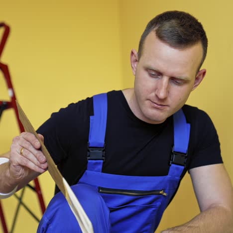 professional man painting wall. painter man at work painting wall with roller