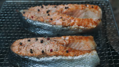 salmon bbq with spice grilling on charcoal grill. close up cooking fish barbecue