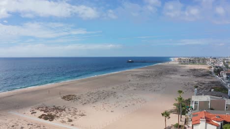 big beachfront houses and balboa peninsula pier in newport beach, california