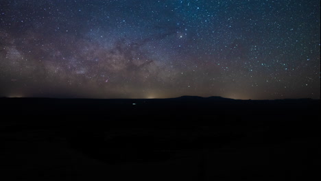 panning time-lapse of the milky way rising over the horizon in canyonlands national park in utah