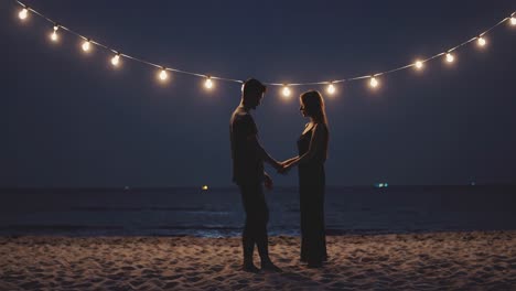 couple at the beach at night