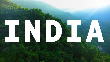 aerial drone shot of forests and mountains in india with animated graphic spelling out india